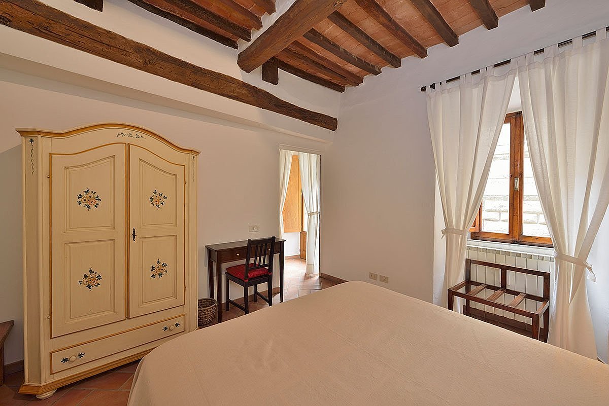 bedroom wide double spacious bright white rustic traditional Tuscan wood